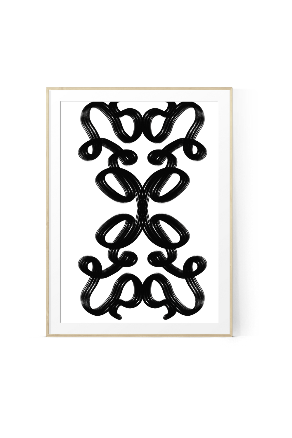 Abstract black and white wall art print featuring a bold, symmetrical design of looping brushstrokes with visible paint texture, showcased in a light wood frame on a plain white background.