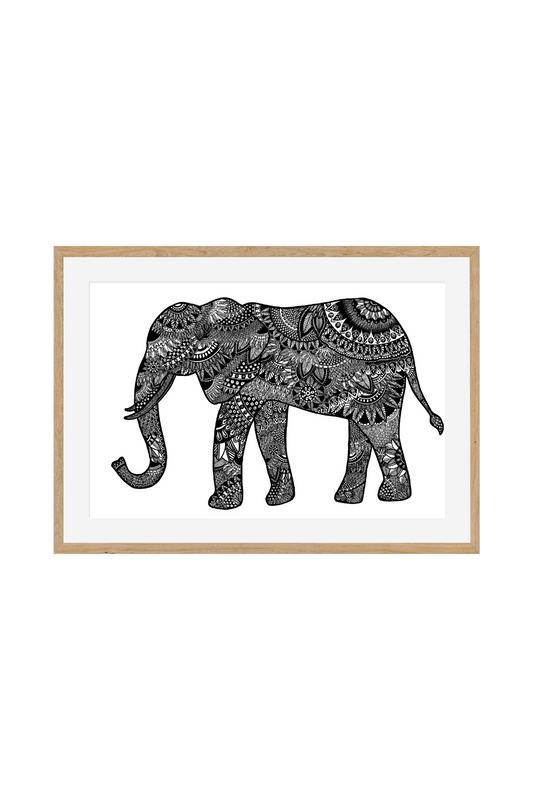 Detailed black and white art print of an elephant filled entirely with intricate mandala art, floral patterns, and geometric lines, framed horizontally in a light wood border.
