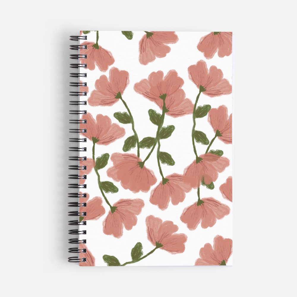 Pink cherry blossom spiral notebook featuring a hand-drawn floral pattern with green leaves and stems
