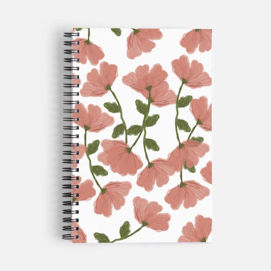 Pink cherry blossom spiral notebook featuring a hand-drawn floral pattern with green leaves and stems