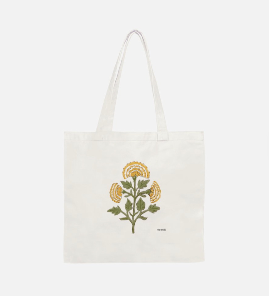 Marigold floral cotton canvas tote bag featuring an Indian-inspired botanical flower design in yellow and green